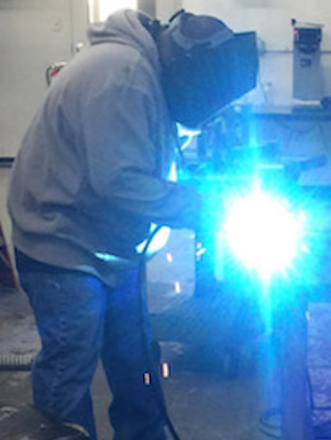 greg welding light with blue arc